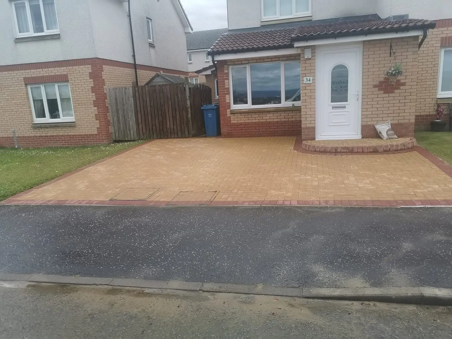 A block-paved driveway pressure washed and re-sanded